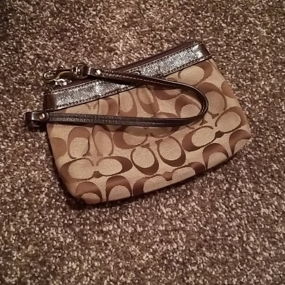 Authentic Coach wristlet with leather accents